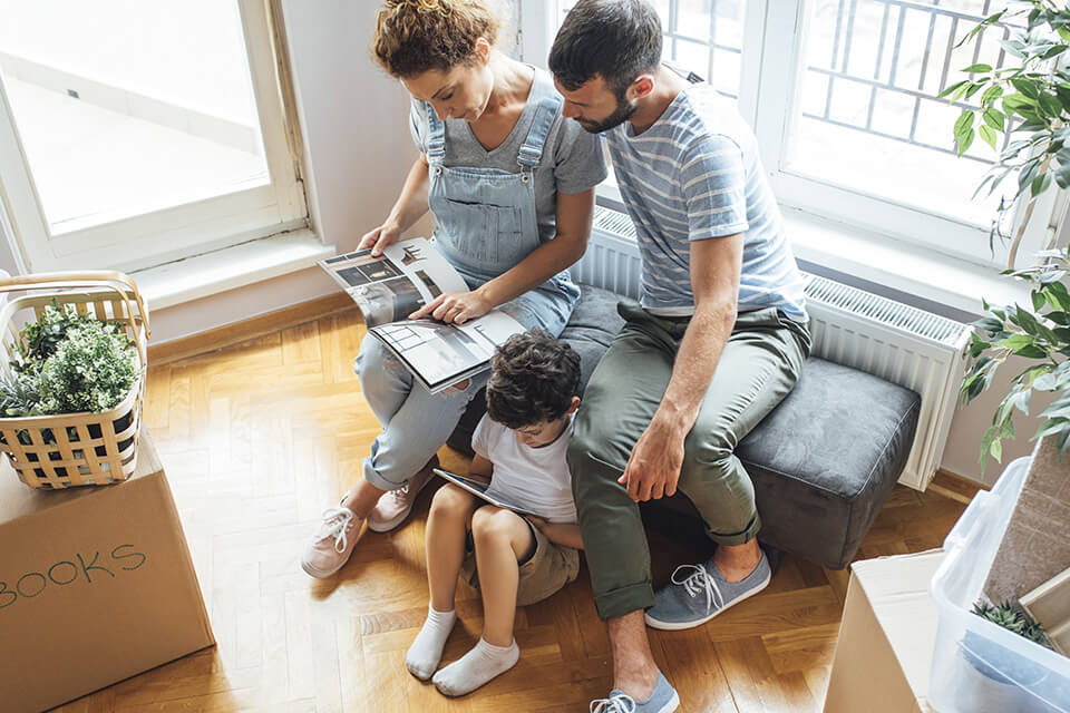 A family looks at a catalog