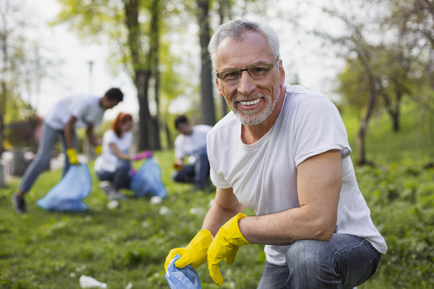 man cleaning up trash